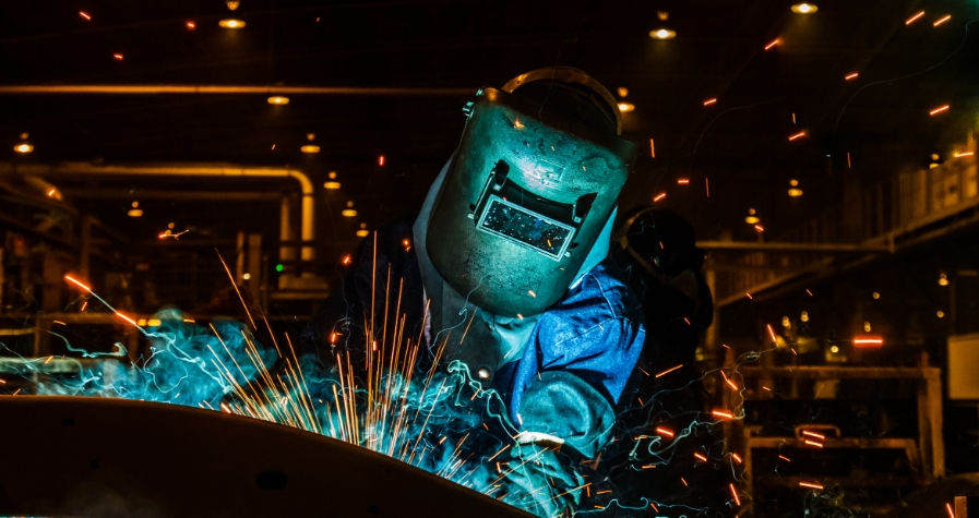 Welder with sparks on his or her face